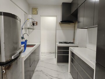 Kitchen in 2 BHK Apartment at Lokhandwala Whispering Palms, Kandivali East – for Rent