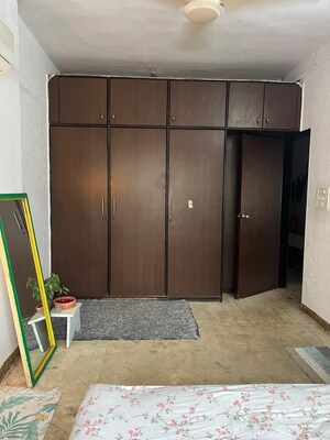 Bedroom in 2 BHK Apartment at Adarsh CHS Oshiwara, Oshiwara – for Rent