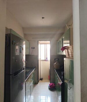 Kitchen in 2 BHK Apartment at Harmony Signature Towers, Owale – for Sale