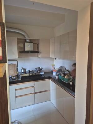 Kitchen in 3 BHK Apartment at Sudarshan Sky Garden, Ghodbunder Road – for Sale