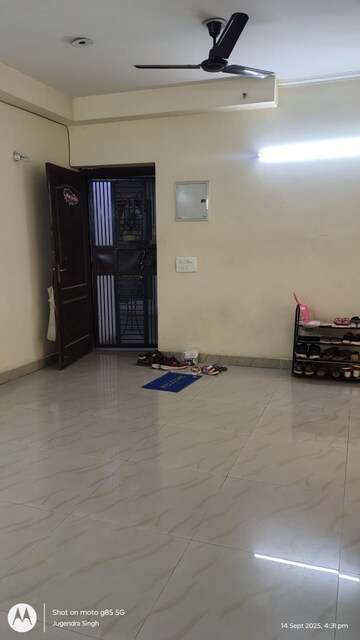 Living Room in 2.5 BHK Apartment at Aims Golf City, Sector 75 – for Rent