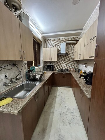 Kitchen in 2 BHK Apartment at Satya The Hive, Sector 102 – for Rent