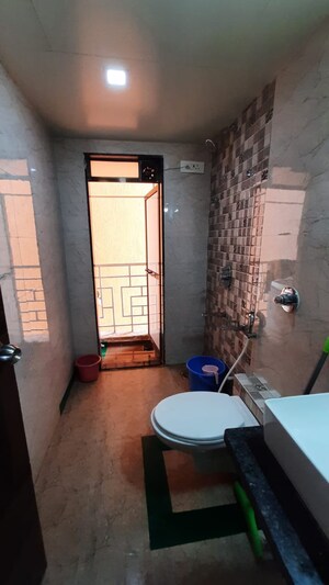 Bathroom in 3 BHK Apartment at Siddhi Highland Haven, Balkum Pada – for Rent