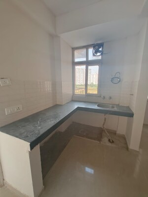 Kitchen in 1 BHK Apartment at Shree Vardhman Green Court, Sector 90 – for Rent