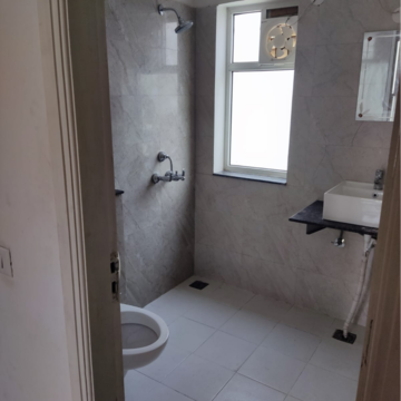 Bathroom in 3 BHK Apartment at International Airport Road – for Rent