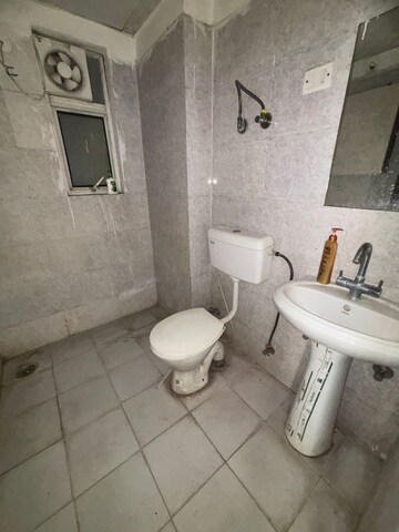 Bathroom in 2 BHK Apartment at Niho Hi Bird Scottish Garden, Ahinsa Khand 2 – for Sale