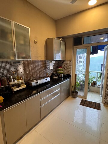 Kitchen in 2 BHK Apartment at Omkar Alta Monte, Malad East – for Rent