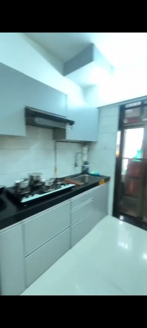 Kitchen in 2 BHK Apartment at Vinay Nagar CHS, Mira Road – for Sale