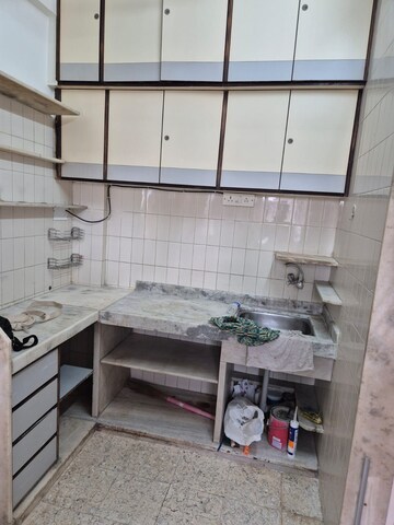 Kitchen in 1 BHK Apartment at Navyug Niwas, Grant Road – for Rent