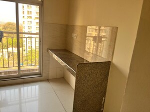Kitchen in 1 BHK Apartment at Puranik Rumah Bali Phase II, Ghodbunder Road – for Rent