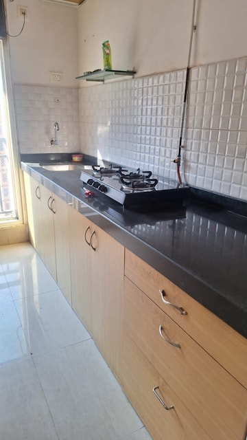 Kitchen in 1 BHK Apartment at Puranik Hometown, Ghodbunder Road – for Rent