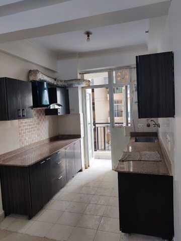 Kitchen in 3 BHK Apartment at Amrapali Silicon City, Sector 76 – for Rent