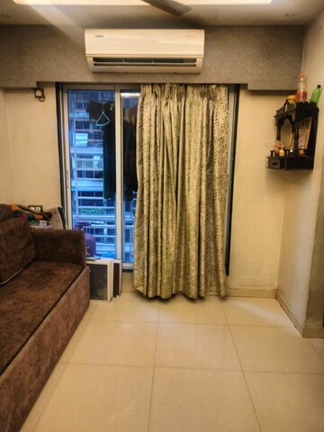 Living Room in 1 BHK Apartment at Shraddha Evoque, Bhandup West – for Rent