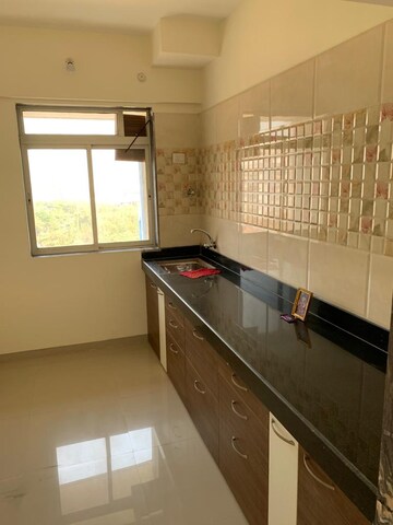 Kitchen in 1 BHK Apartment at Raunak Unnathi Greens, Kasarvadavali – for Rent