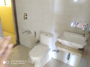 Bathroom in 1 BHK Apartment at Raunak Unnathi Woods, Ghodbunder Road – for Rent