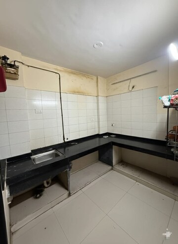 Kitchen in 2 BHK Apartment at Gokul Nagari Kalyan, Kalyan West – for Rent