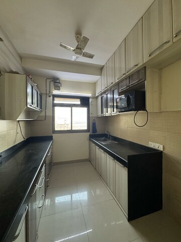 Kitchen in 1 BHK Apartment at Puranik City Reserva, Ghodbunder Road – for Rent