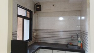 Kitchen in 1 BHK Apartment at Naupada – for Sale