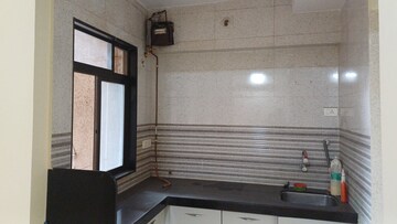 Kitchen in 1 BHK Apartment at Naupada – for Sale