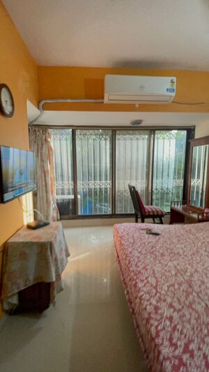 Living Room in 2 BHK Apartment at Juhu Natraj CHS, Vile Parle West – for Rent