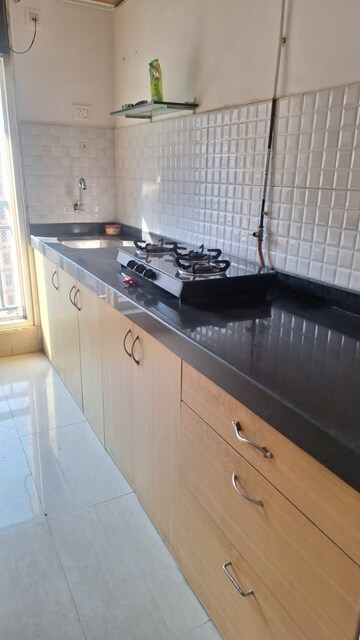 Kitchen in 1 BHK Apartment at Raunak Bliss, Ghodbunder Road – for Sale