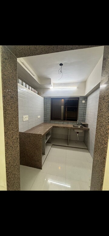 Kitchen in 1 BHK Apartment at Prarthana Rajkamal Park, Parel – for Rent