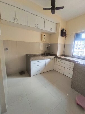 Kitchen in 1 BHK Apartment at Lodha Amara, Kolshet Road – for Sale