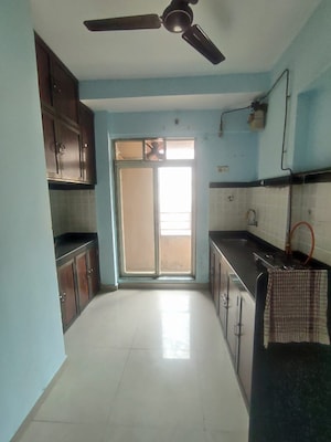 Kitchen in 1 BHK Apartment at Mahavir Kalpavruksha, Ghodbunder Road – for Rent