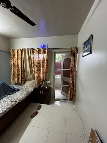 Room in 2 BHK Apartment at Sai Dham CHS, Dhanori – for Rent