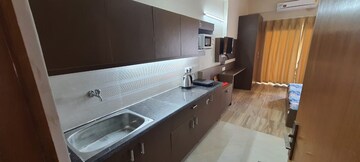 Kitchen in 1 RK Apartment at Paramount Golf Forest Studio Apartments - OAK Towe, Zeta I Greater Noida – for Rent