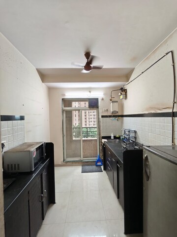 Kitchen in 1 BHK Apartment at Raunak Heights, Ghodbunder Road – for Rent