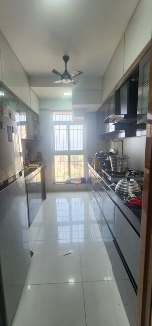 Kitchen in 1 BHK Apartment at Raunak Heights, Ghodbunder Road – for Rent