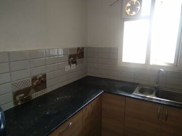 Kitchen in 2 BHK Apartment at Gaur City 2 - 12th Avenue, Sector 16c Greater Noida – for Rent