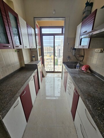 Kitchen in 2 BHK Apartment at Coral Heights, Kavesar – for Rent