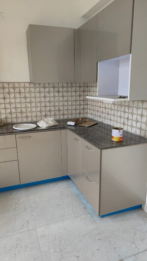 Kitchen in 3.5 BHK Apartment at Mahagun Meadows, Sector 150 – for Rent