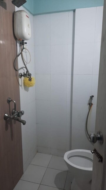 Bathroom in 1 BHK Apartment at Raunak Unnathi Woods Phase 4 And 5, Ghodbunder Road – for Rent