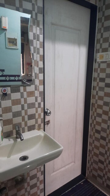 Bathroom in 1 BHK Apartment at Raunak Unnathi Woods Phase 4 And 5, Ghodbunder Road – for Rent
