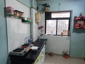 Kitchen in 1 BHK Apartment at Raunak Unnathi Woods Phase 4 And 5, Ghodbunder Road – for Rent