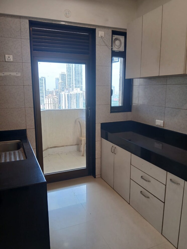 Kitchen, peninsula-celestia-spaces 3 Bedroom 1450 Sq.Ft. Apartment In Parel Mumbai 9254514