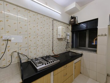 Kitchen in 1 BHK Apartment at Aakanksha Garden, Manpada – for Rent