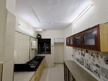 Kitchen in 1 BHK Apartment at Aakanksha Garden, Manpada – for Rent