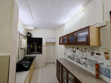 Kitchen in 1 BHK Apartment at Aakanksha Garden, Manpada – for Rent