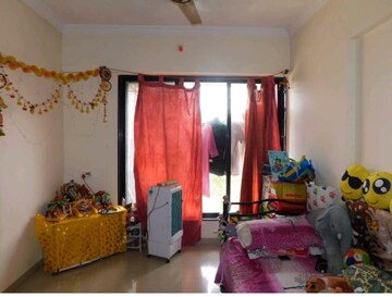 Living Room in 1 BHK Apartment at Raunak Unnathi Greens, Kasarvadavali – for Sale