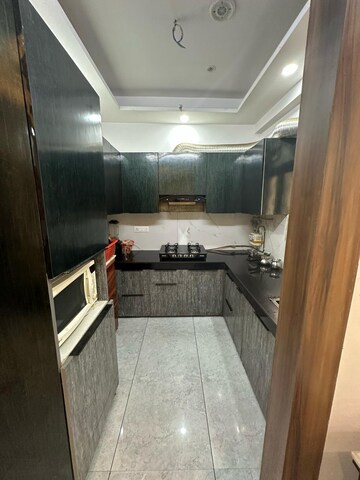 Kitchen in 2 BHK Apartment at Nilaya Greens, Raj Nagar Extension – for Rent