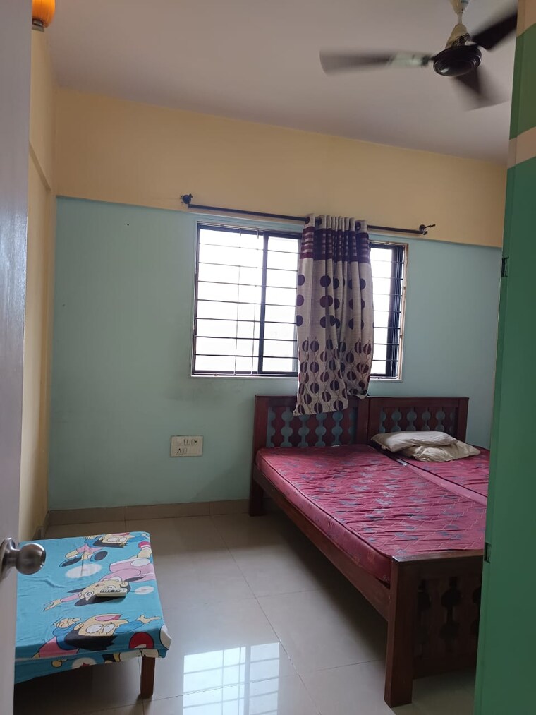 Bedroom, magarpatta-city-cosmos 2 Bedroom 980 Sq.Ft. Apartment In Magarpatta Road Pune 9257736