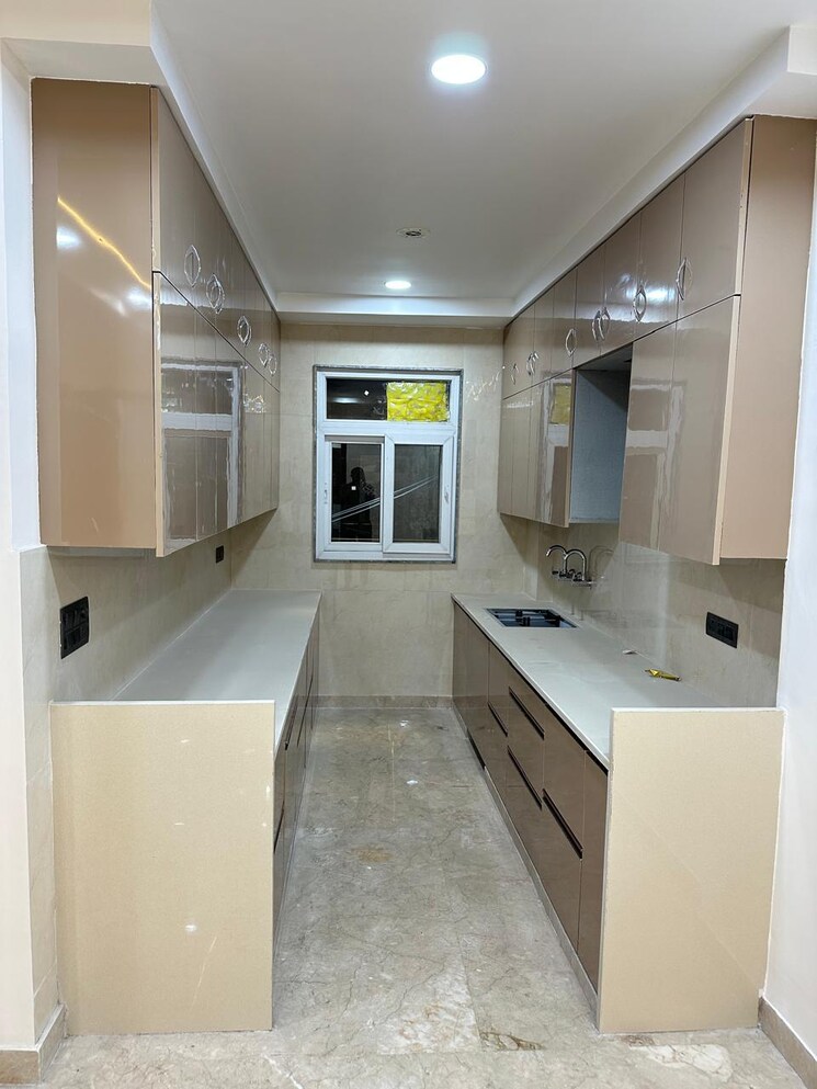 Kitchen, ganga-triveni-apartment 3 Bedroom 1300 Sq.Ft. Apartment In Rohini Sector 9 Delhi 9258168