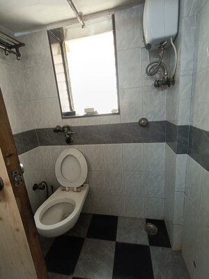 Bathroom in 2 BHK Apartment at Mandar Apartments, Andheri West – for Rent