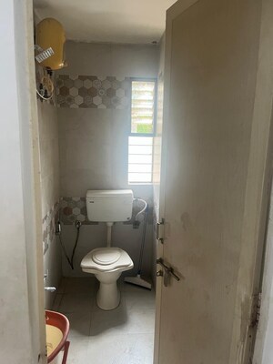 Bathroom in 2 BHK Apartment at Ramdevnagar – for Rent