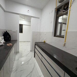 Kitchen in 2 BHK Apartment at Raymond Realty Phase II, Swastik Garden – for Rent