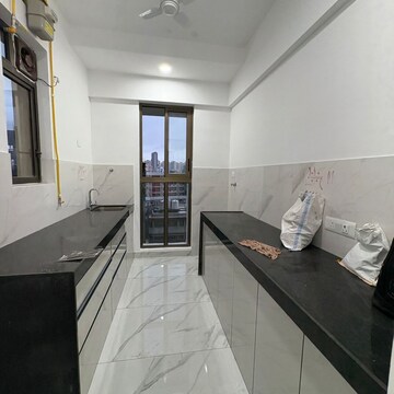 Kitchen in 2 BHK Apartment at Raymond Realty Phase II, Swastik Garden – for Rent